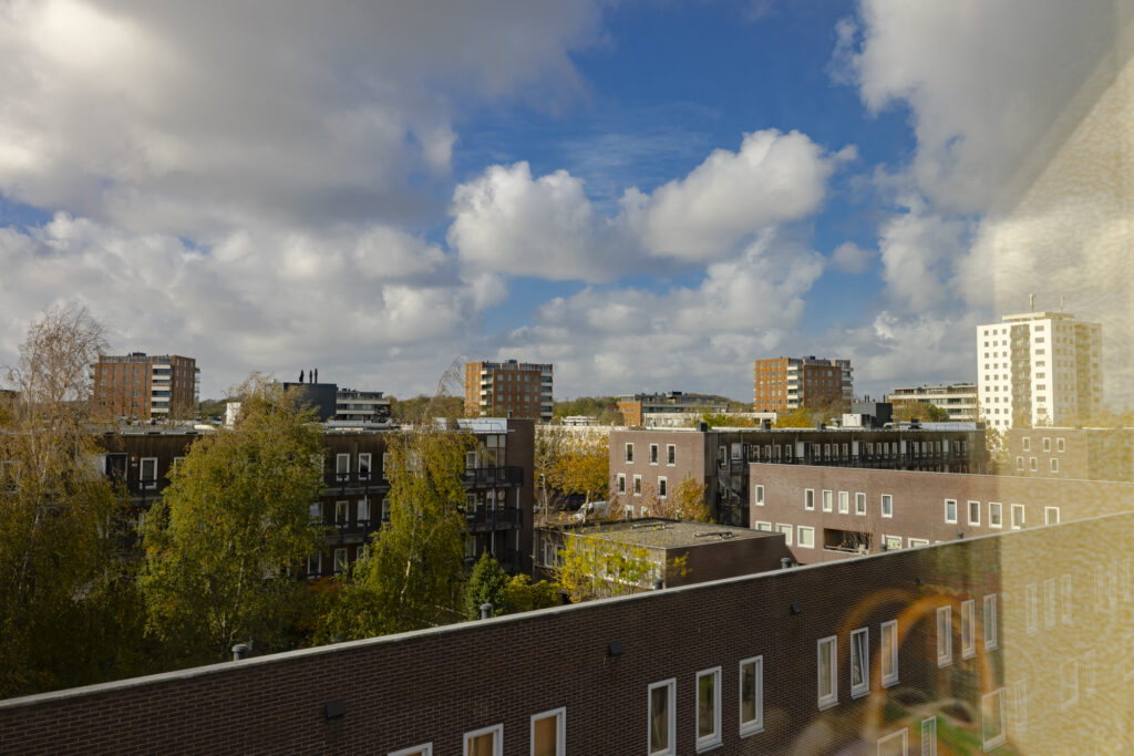 Cityscape with cloudy sky and buildings
