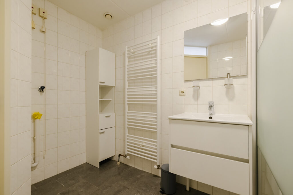 Modern bathroom with sink and towel radiator