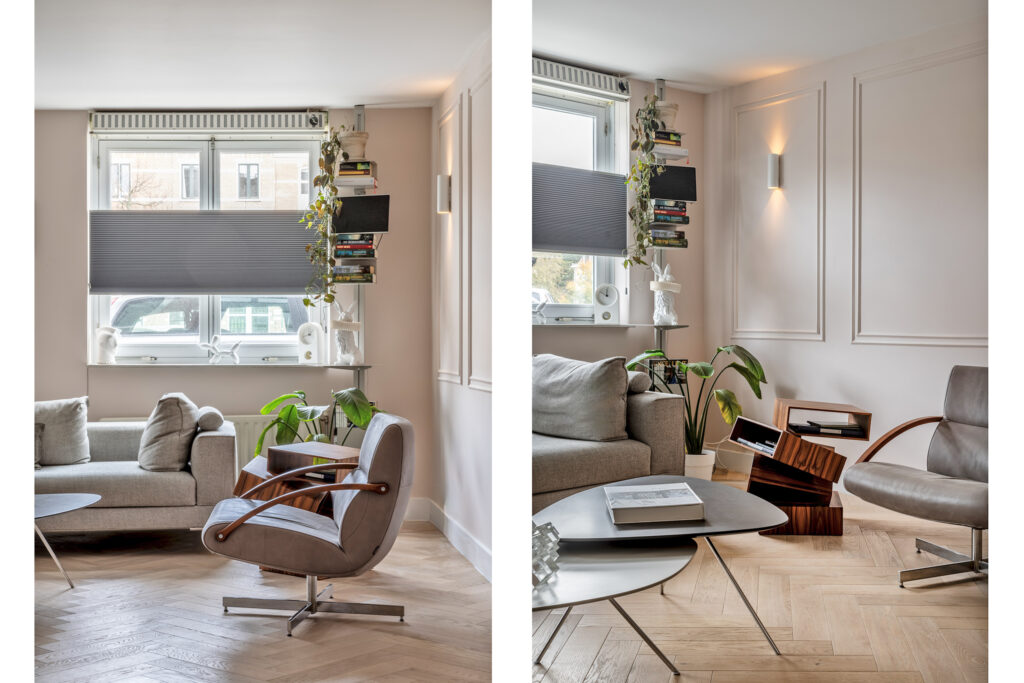 Modern living room with plants and bookshelves.