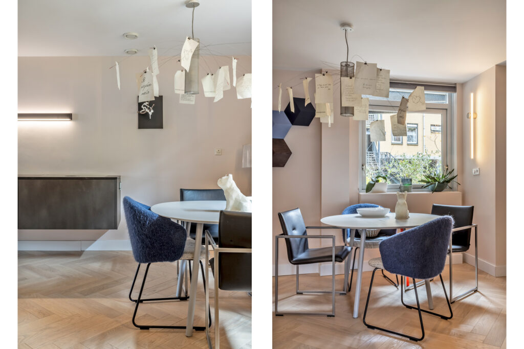 Modern dining room with creative light fixture.