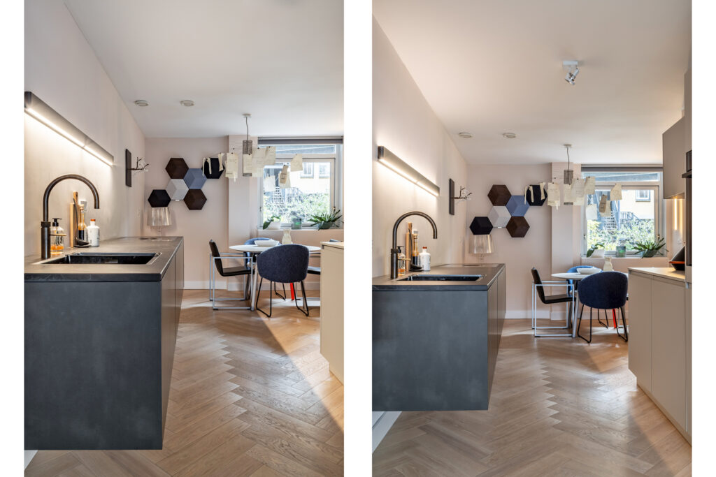 Modern kitchen with dining area and decorative wall art.
