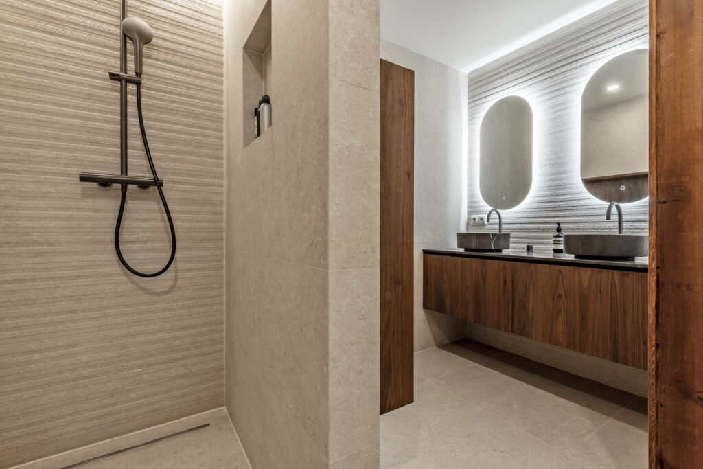 Modern bathroom with shower and double sink vanity.