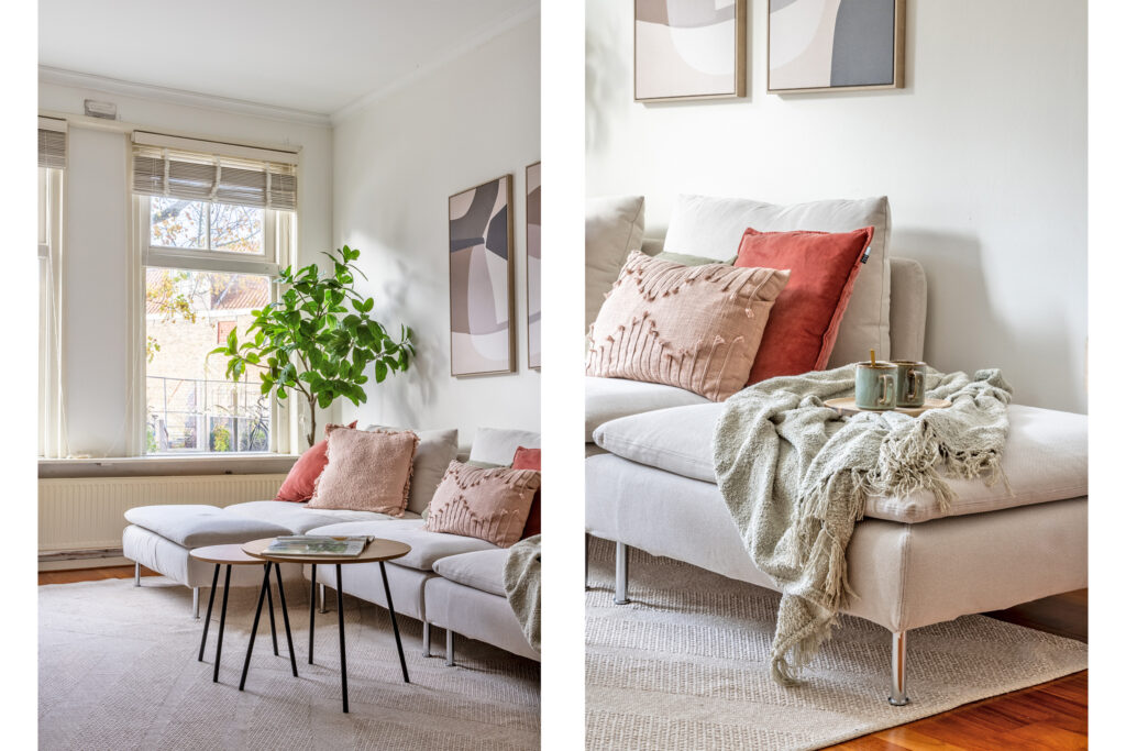Cozy living room with sofa and decorative pillows.