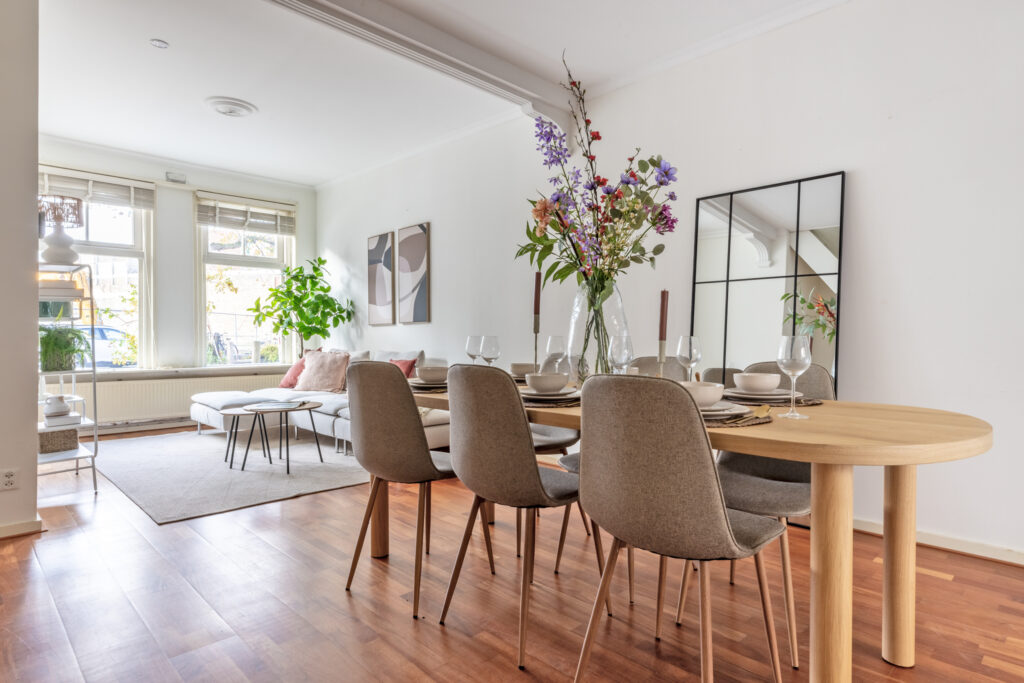 Modern dining and living room with large windows