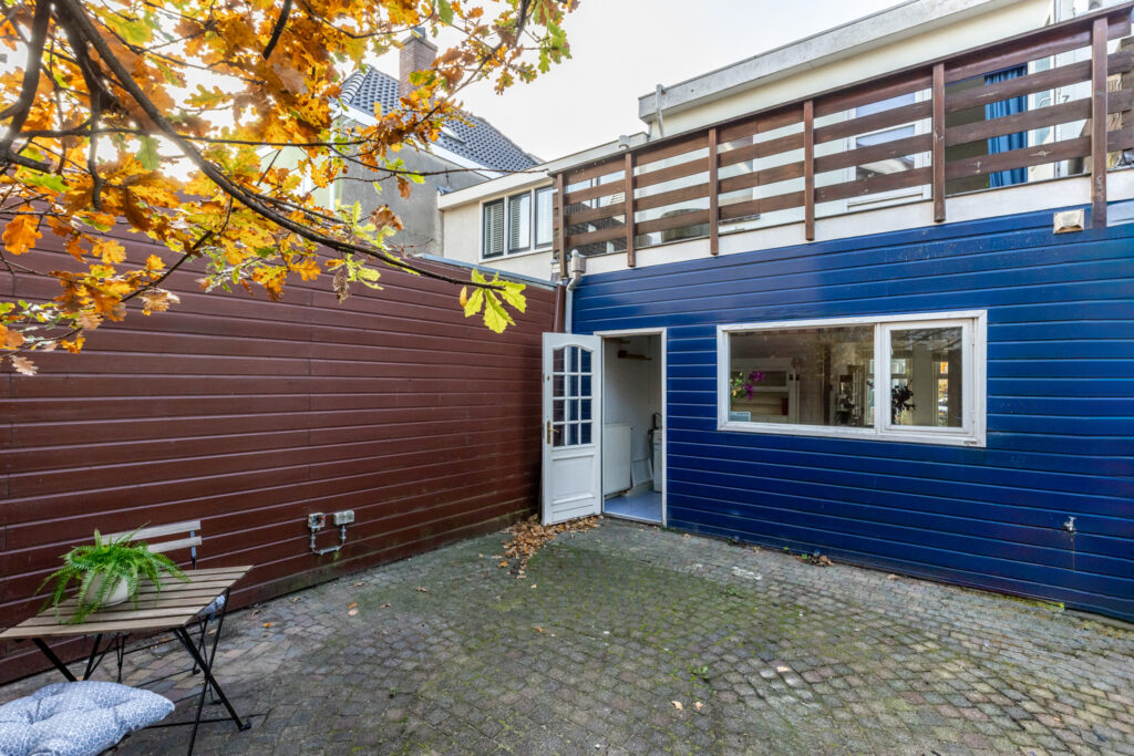 Cozy backyard with patio and open door