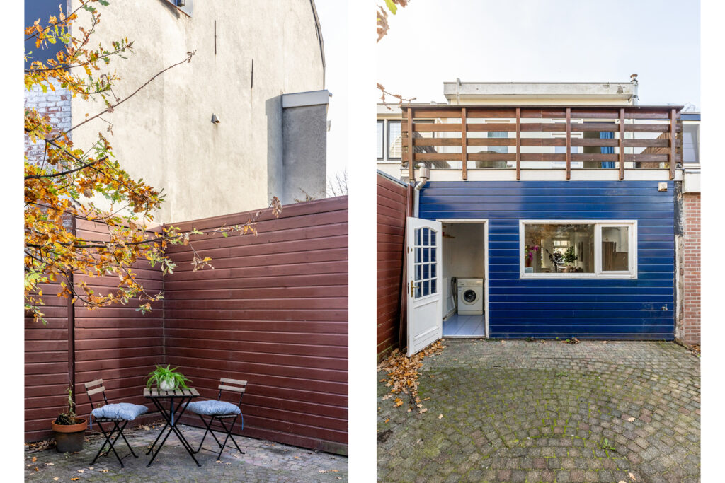 Compact backyard with chairs, washing machine, blue panel.