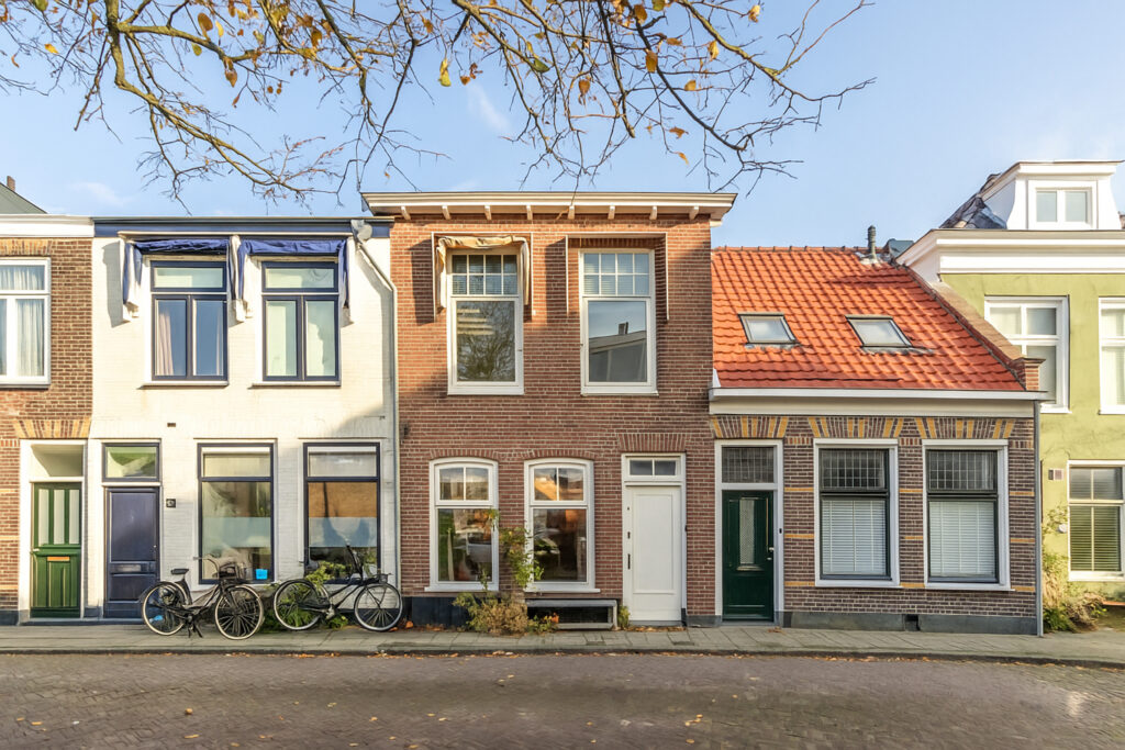 Charming Dutch townhouses with bicycles in front.