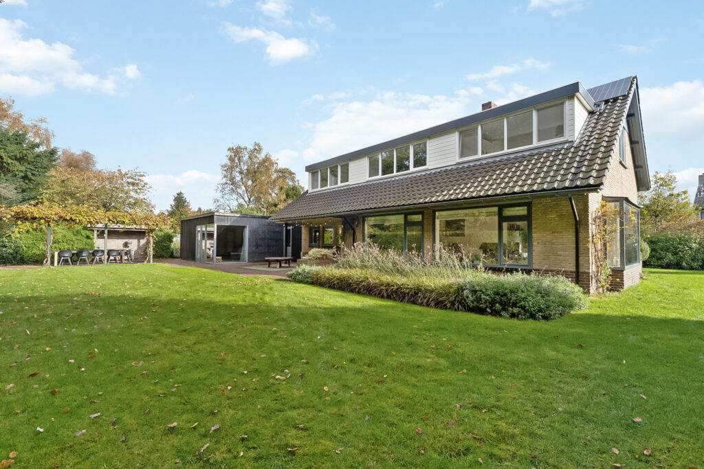 Modern house with spacious green lawn