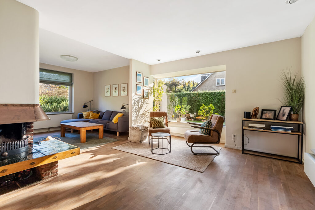 Cozy living room with fireplace and large window
