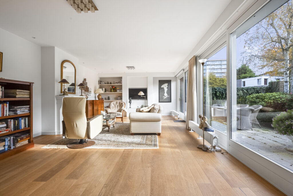 Bright modern living room with large windows.