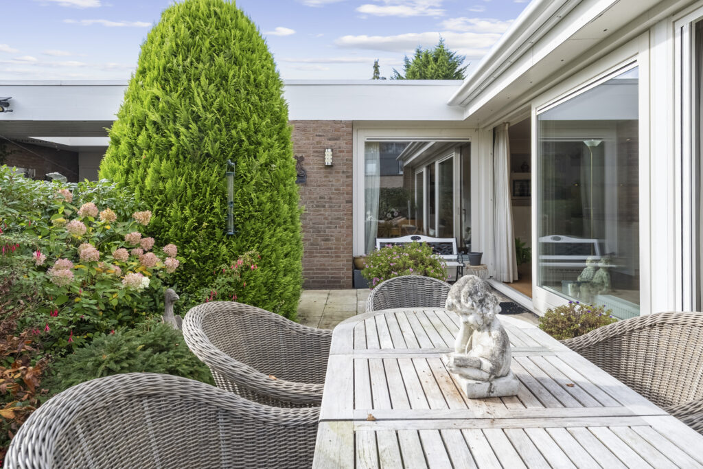 Cozy patio with wicker chairs and plants