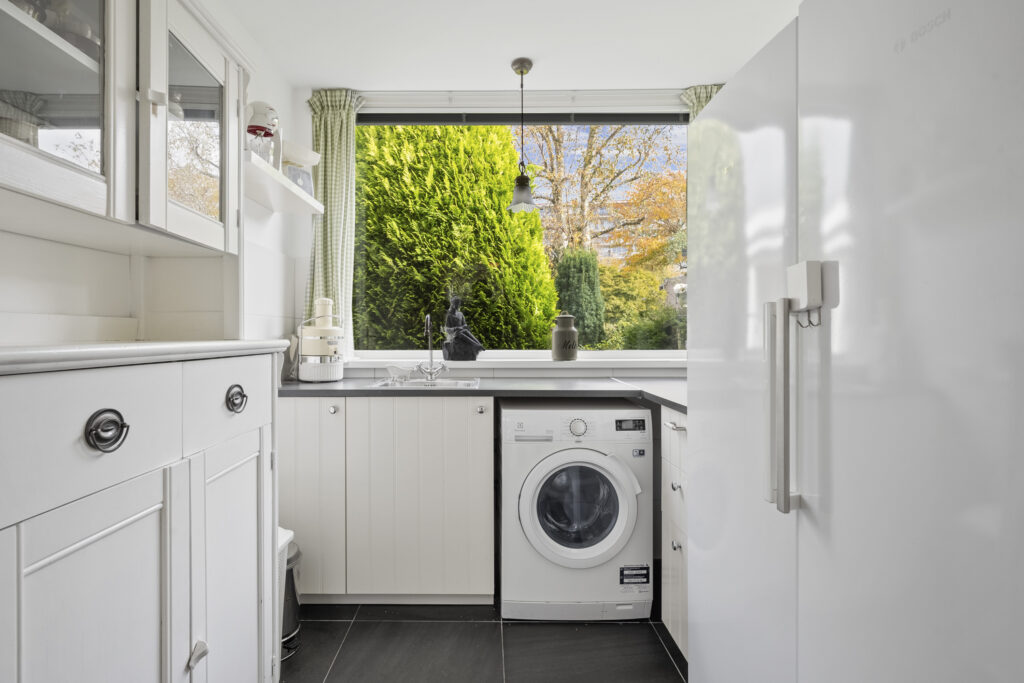 Modern laundry room with large window view