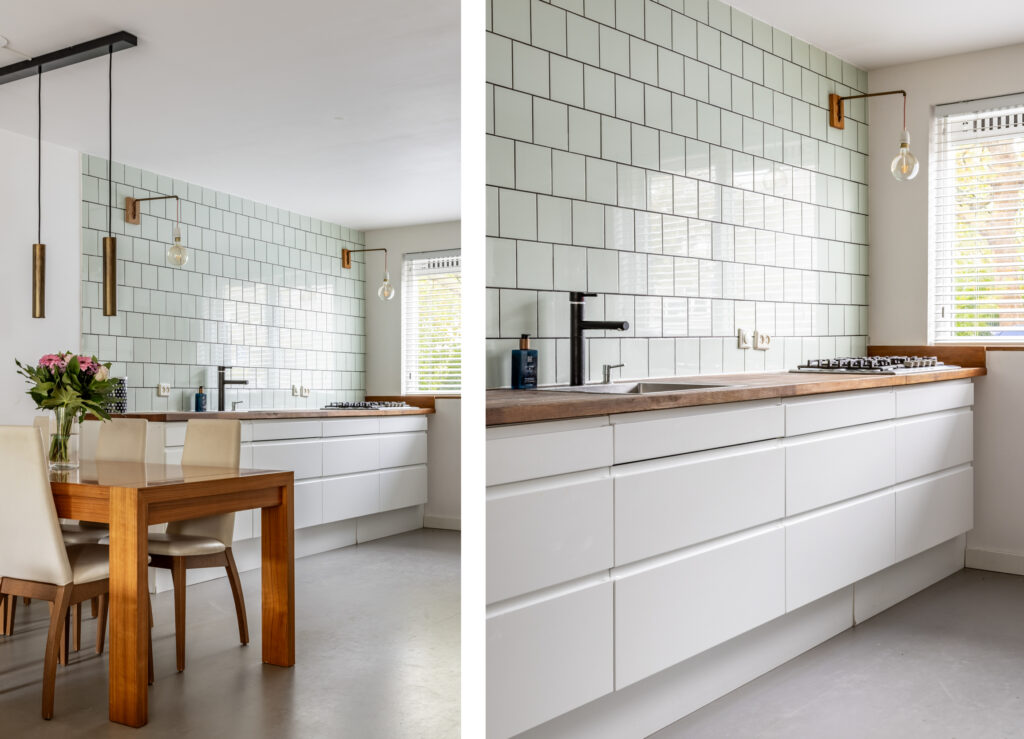 Modern kitchen with wooden table and white cabinets