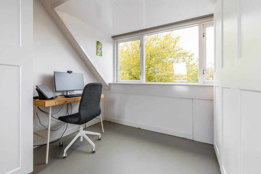 Small home office with desk and chair.