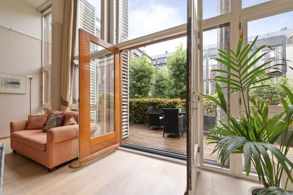 Modern living room with open deck view.