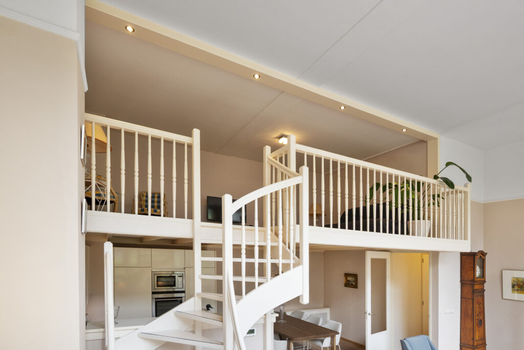 Modern loft interior with spiral staircase.