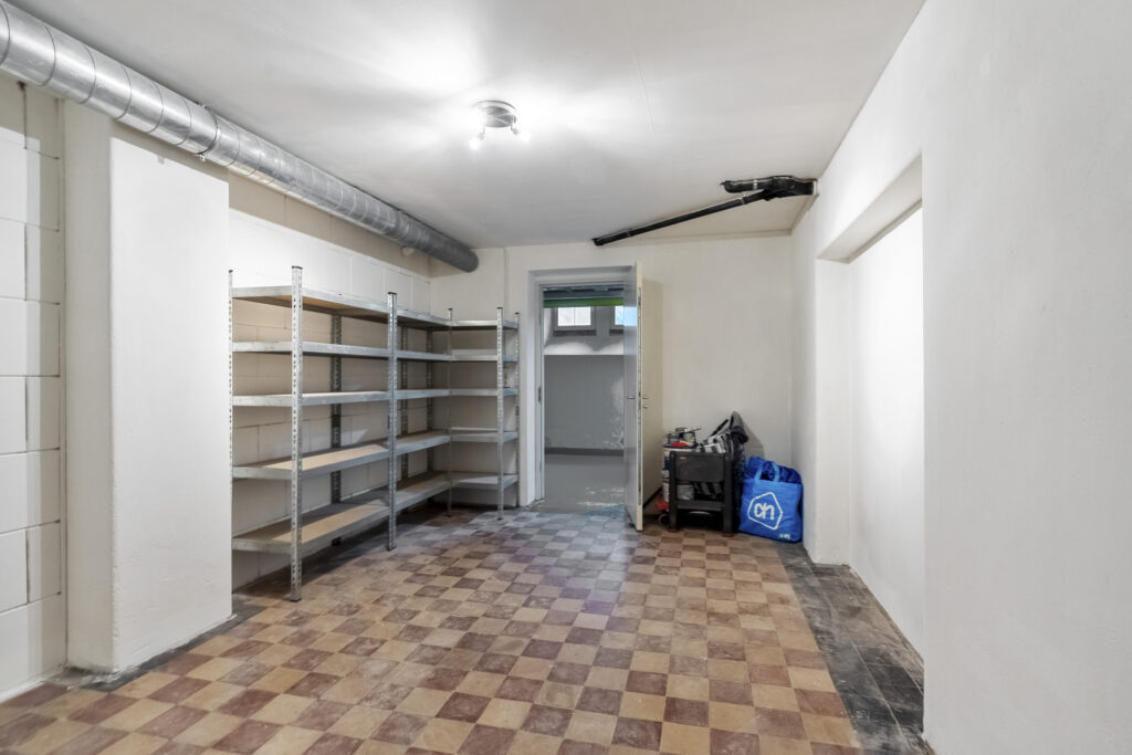 Empty storage room with metal shelves
