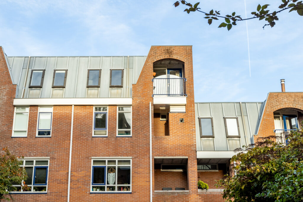 Modern brick apartment building with multiple windows