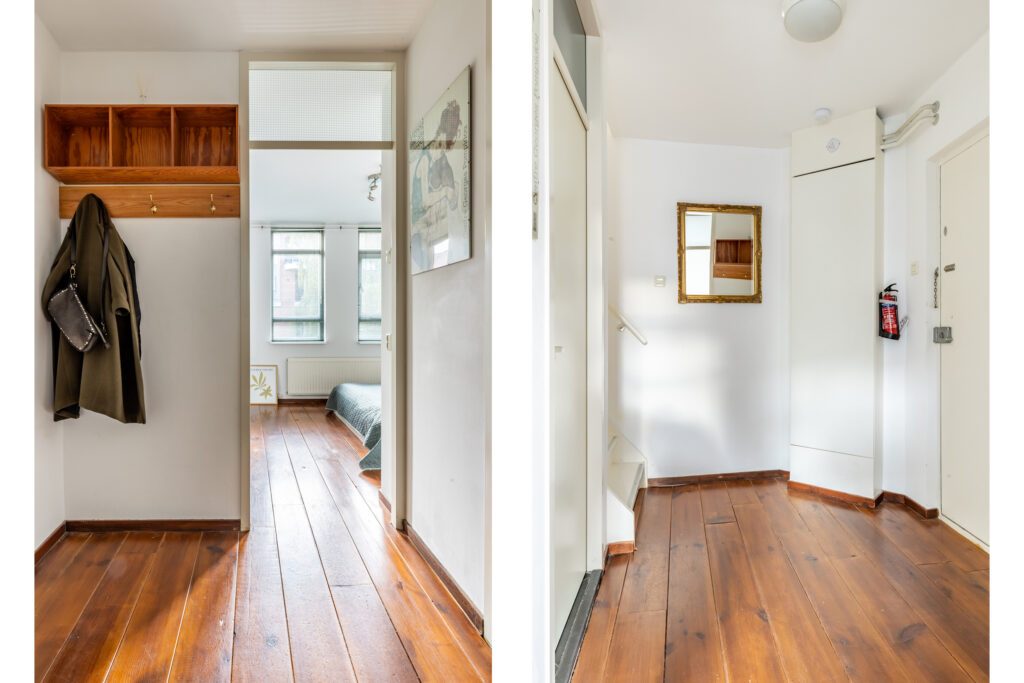 Modern hallway with wooden flooring and coat hooks.