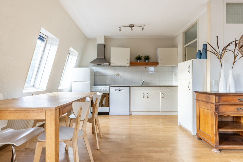 Bright kitchen with wooden table and chairs