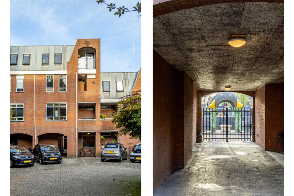 Modern brick building with arched entrance and parking