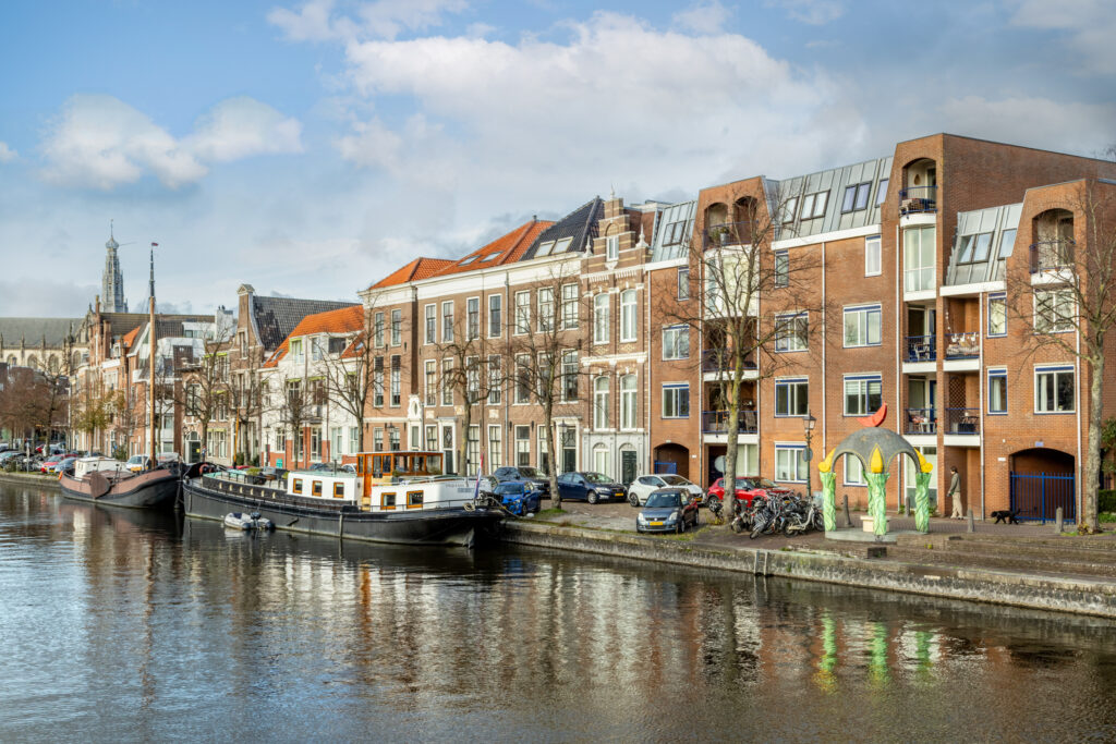 Canal view with boats and historic buildings.