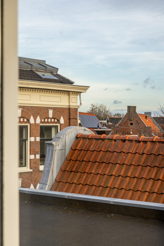 Old brick buildings with red tile roofs.