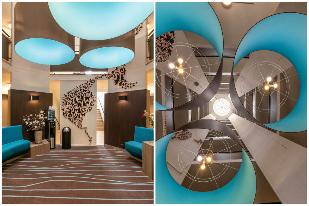 Modern lobby with blue ceiling light design.