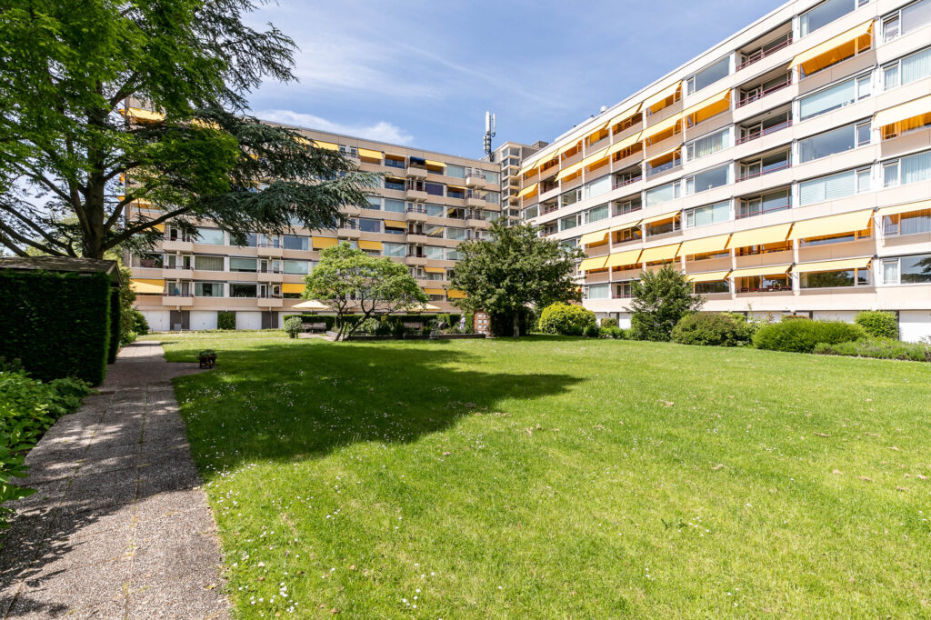 Apartment building with grassy courtyard view