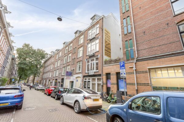 Electric cars charging on a city street.
