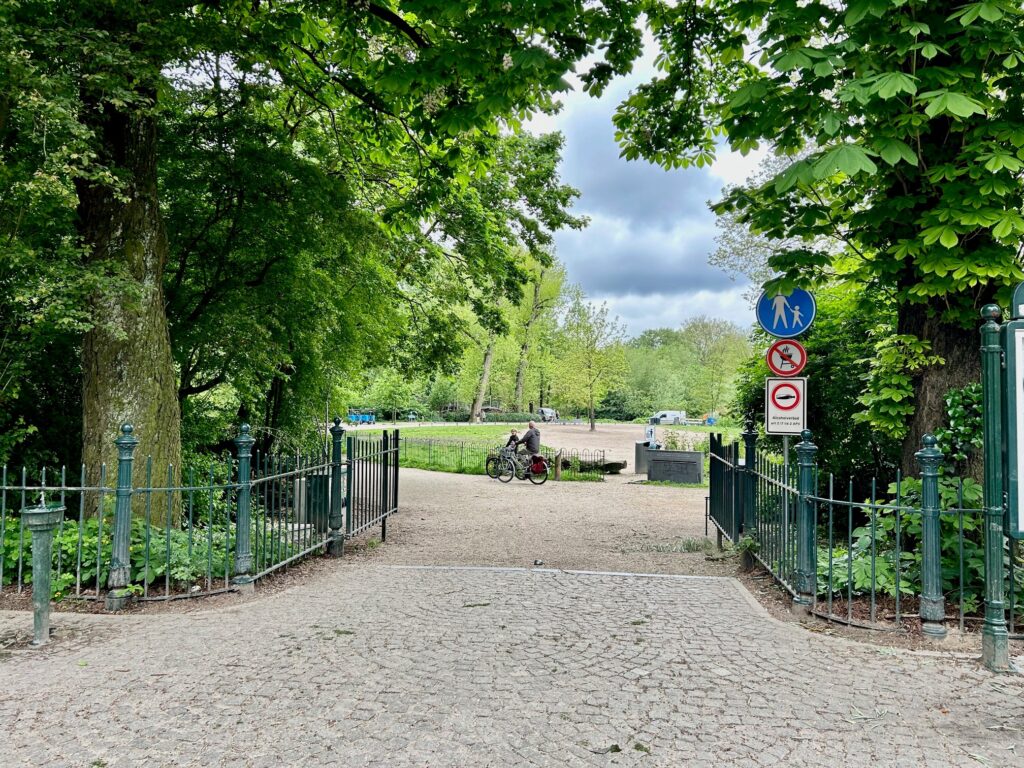 Park entrance with pathway and signs