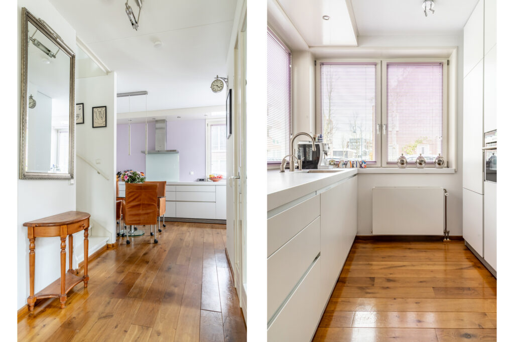 Modern kitchen with wooden floors and sleek cabinets