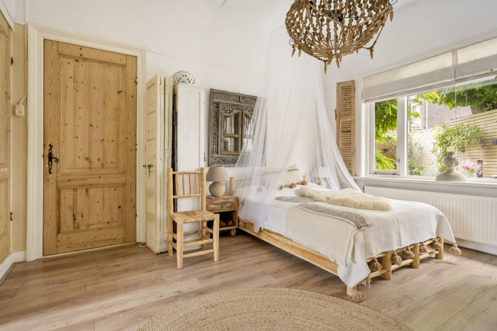 Cozy bedroom with rustic decor and natural light.