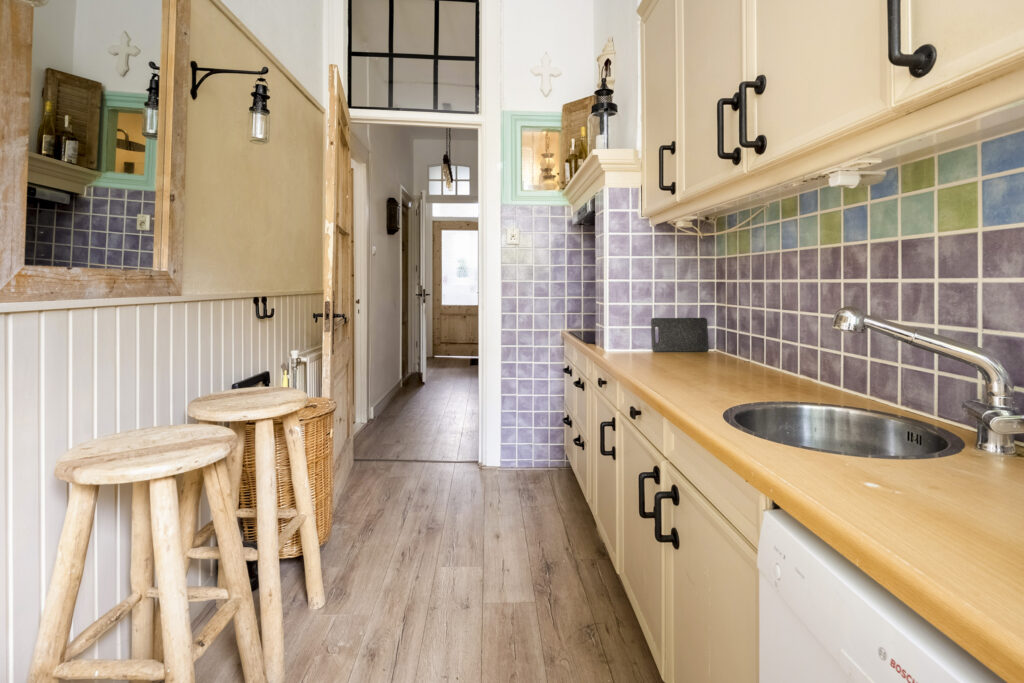 Rustic kitchen with wooden counters and stools