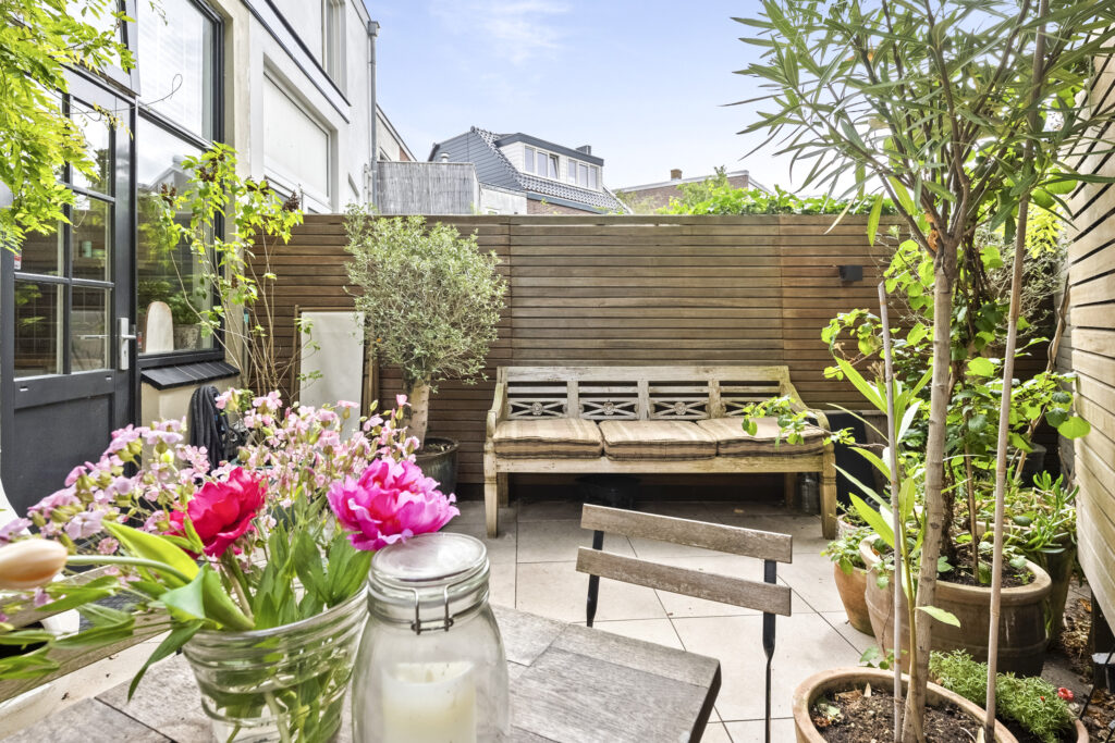 Cozy patio with bench and potted plants