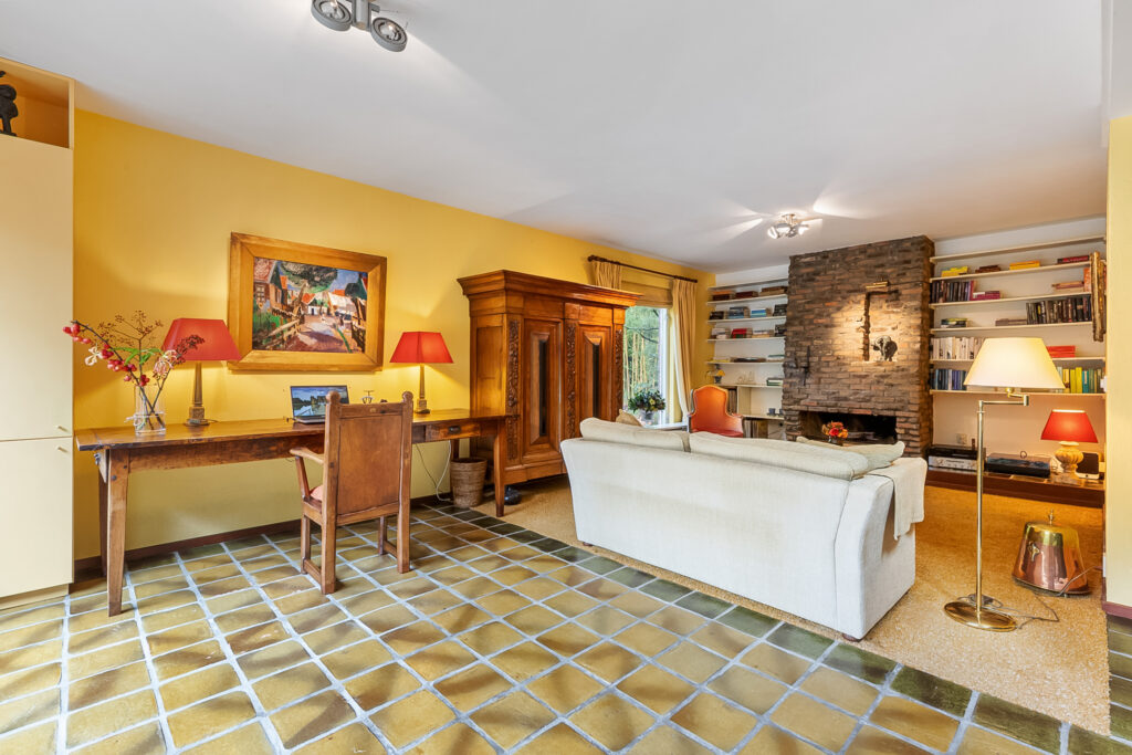 Cozy living room with yellow walls and decor.