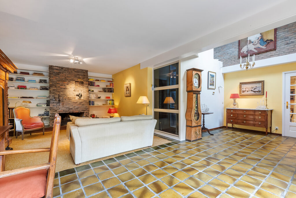 Cozy living room with fireplace and grandfather clock.