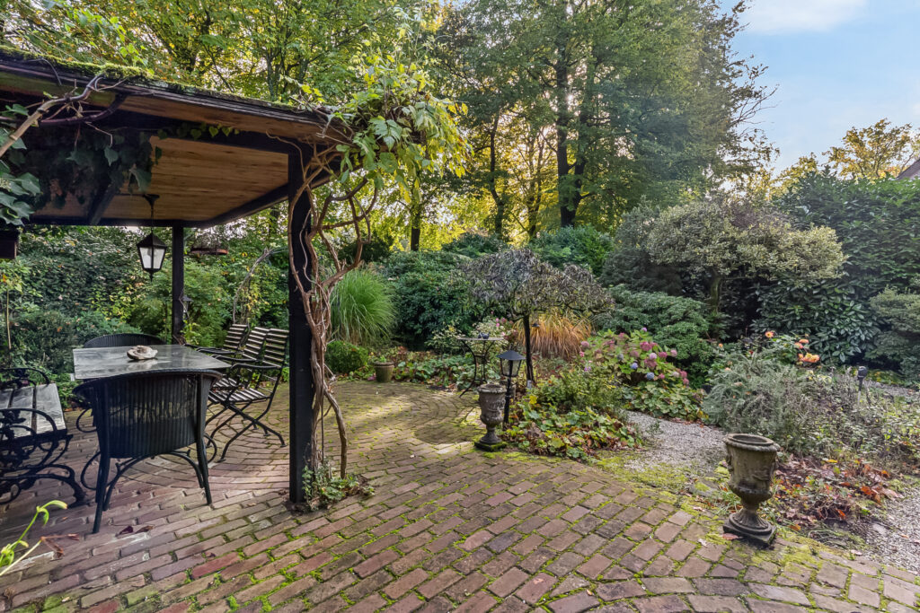 Brick patio garden with table and chairs