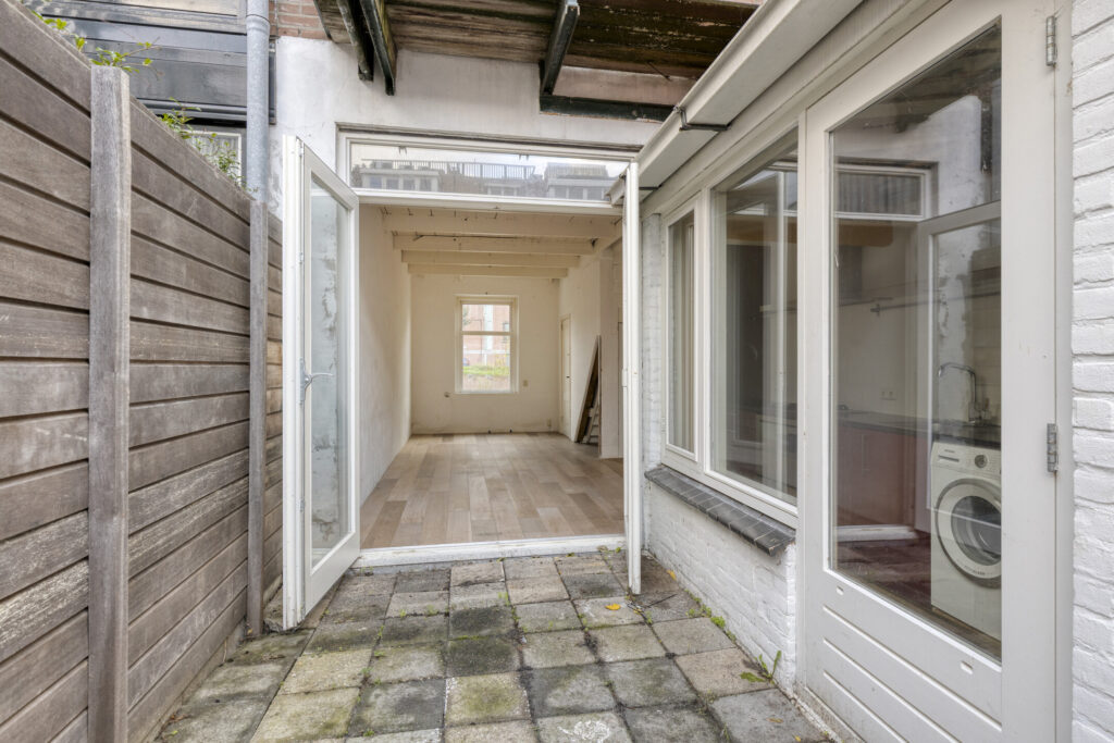 Open patio entrance to bright room.