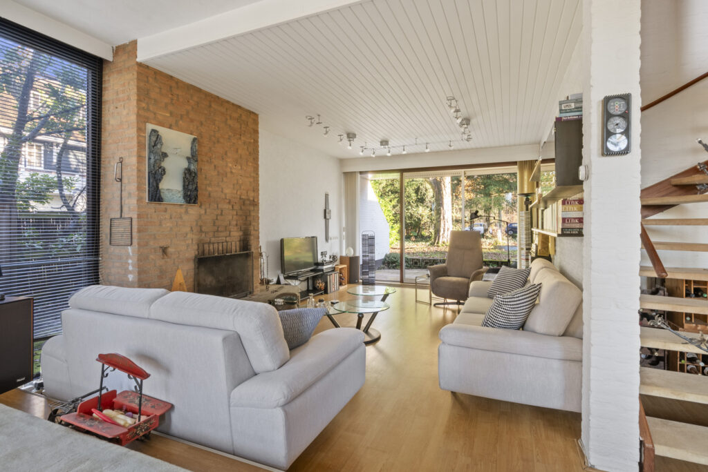 Modern living room with large window view.