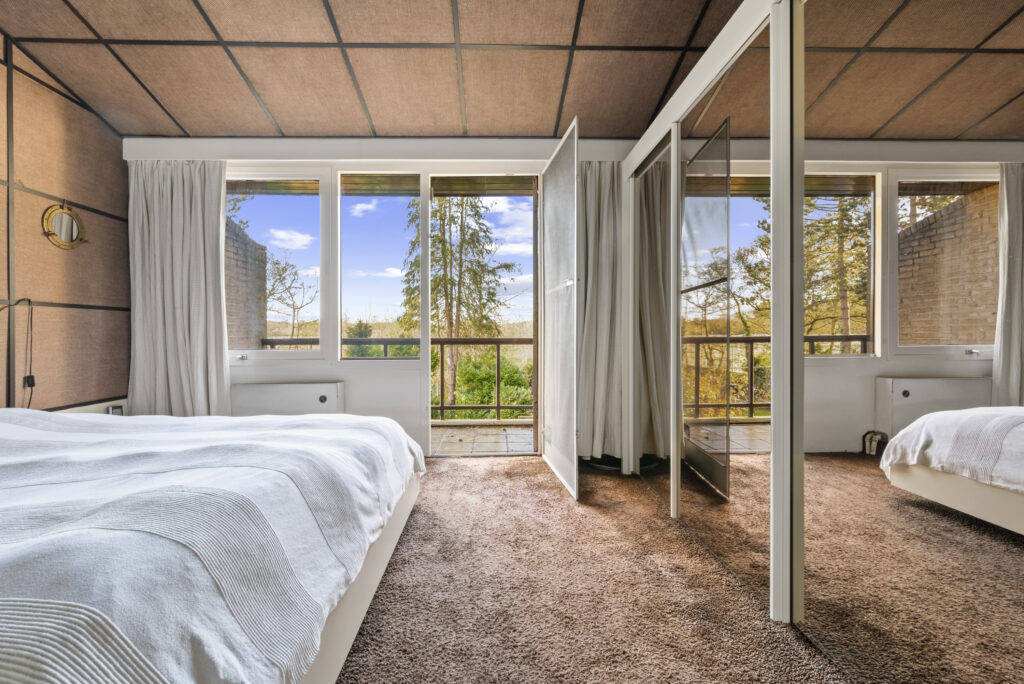 Bright bedroom with open balcony view