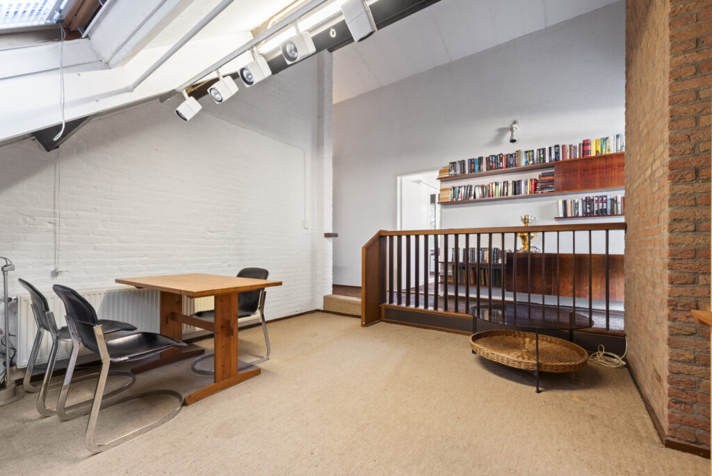 Cozy office with bookshelves and wooden desk