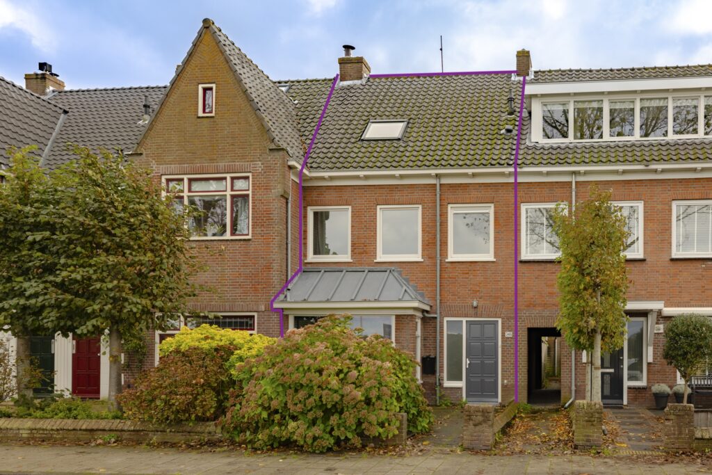 Brick row house with grey doors and windows.