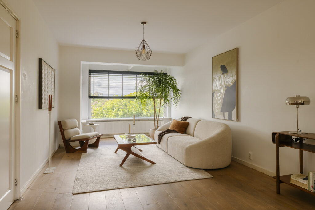 Modern living room with sofa and large window.