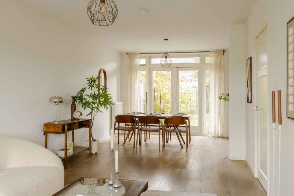 Bright dining room with wooden furniture, natural light.