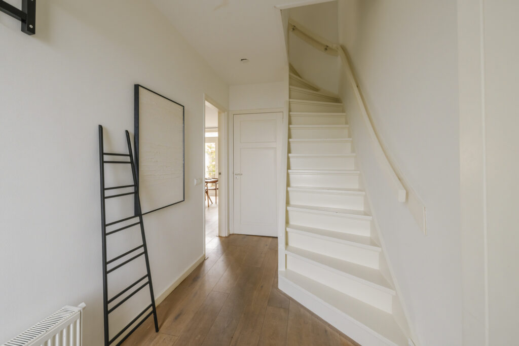 Minimalist interior with wooden stairs and ladder decor