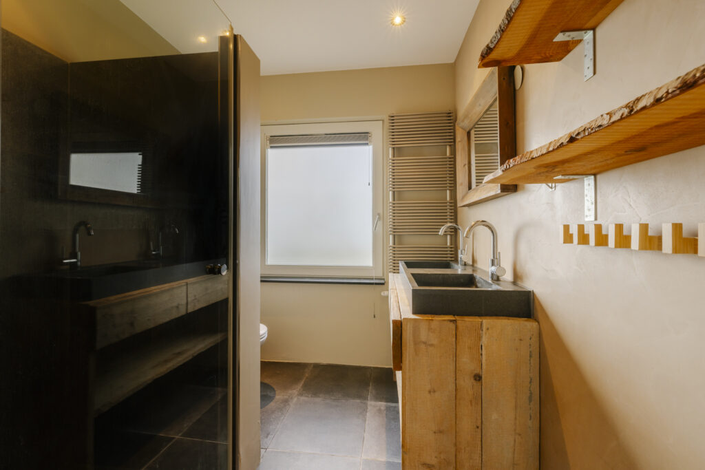 Modern bathroom with wooden decor and double sink