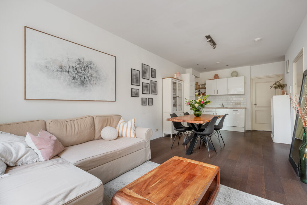 Modern living room with cozy beige sofa.