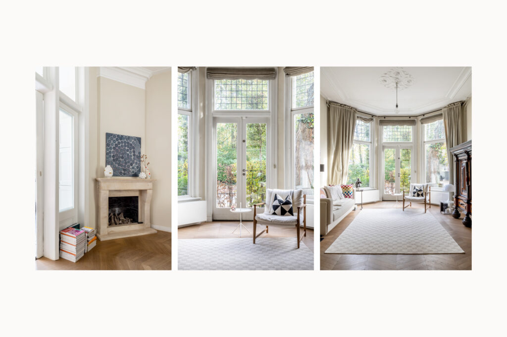 Bright living room with large windows and fireplace.
