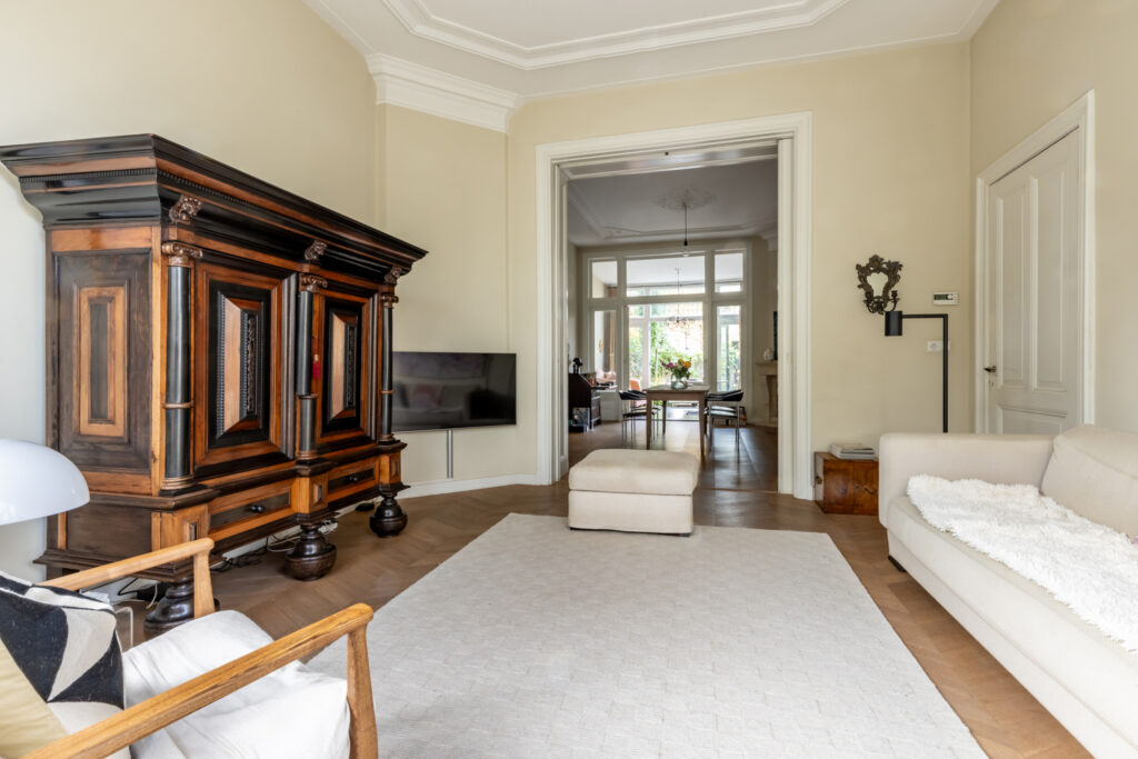 Elegant living room with vintage wooden furniture.